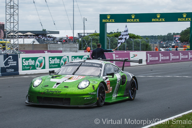 The #99 Proton Competition Porsche 911 RSR driven by Patrick Long, Timothy Pappas and Spencer Pumpelly crosses the finishing line, claiming fourth place in the GTE Am class