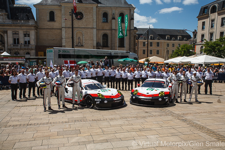 The factory #91 and #92 Porsche 911 RSR crew and team pose for the Scrutineering photograph