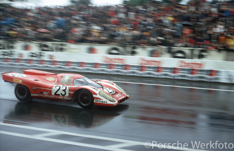 The winning #23 Porsche 917 KH of Herrmann/Attwood splashes down the main start/finish straight