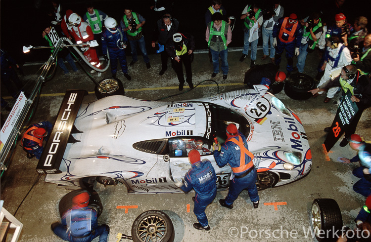 The winning #26 Porsche 911 GT1-98 driven by Allan McNish, Stéphane Ortelli and Laurent Aiello calls into the pits