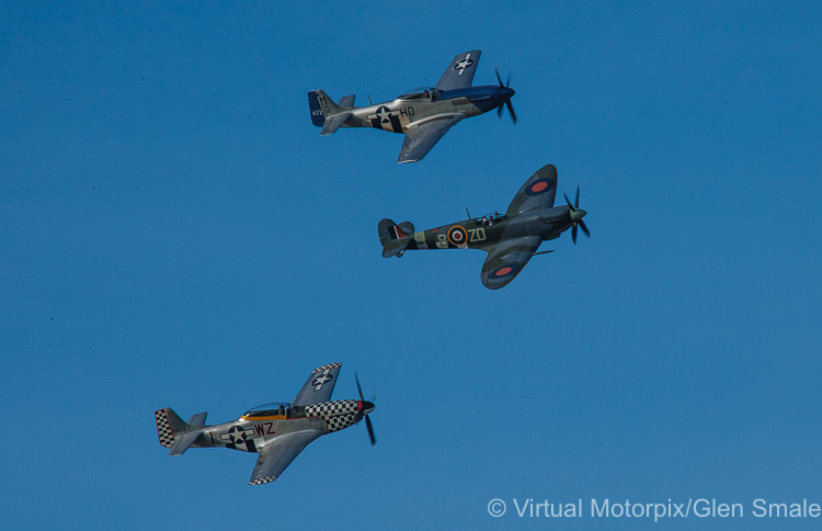 A pair of Mustangs and a Spitfire take to the skies early on Sunday morning at the Goodwood Revival