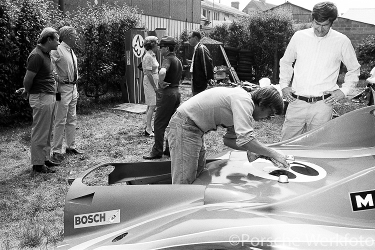 Le Mans 1970: Standing outside the rear of the workshop in Teloché before the race are (from L – R) Tony Lapine, Huschke von Hanstein, Ursula von Hanstein, Ferry Porsche (in hat and dark glasses), and Peter Falk