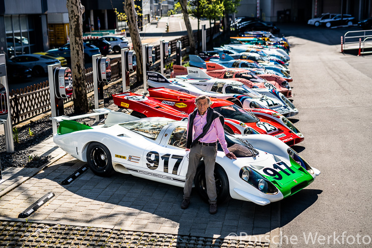 Hans Mezger leans against 917-001 in a line-up of 917 legends (2019)