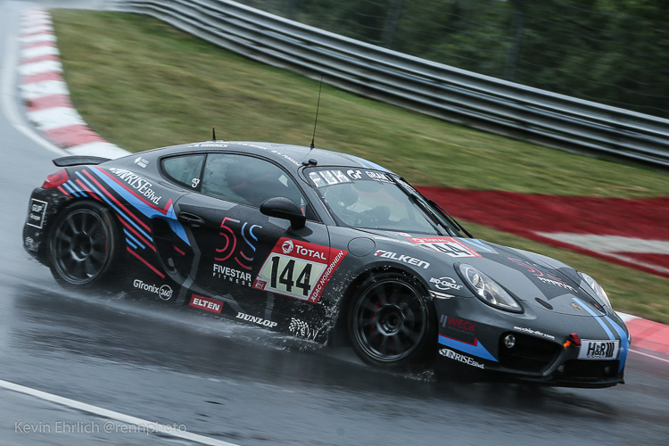 #144 Cayman splashes through Hatzenbach during practice