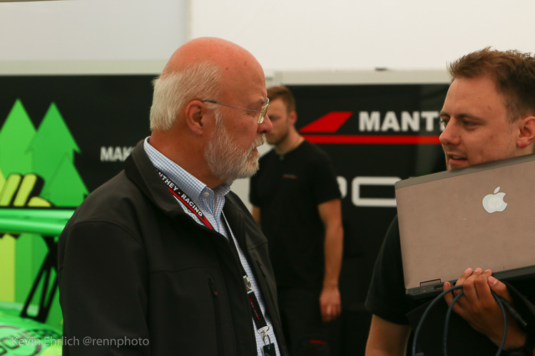 Team Principal Olaf Manthey discusses the car’s set up with a colleague