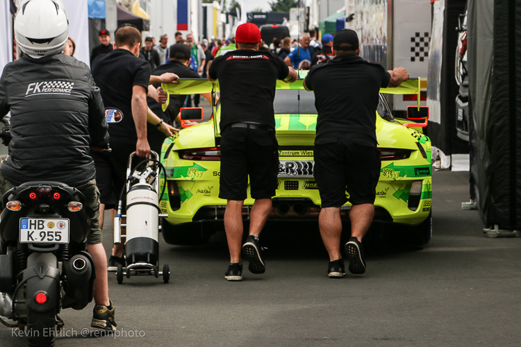 The #911 Manthey Racing Porsche 911 GT3 R is pushed to grid ahead of the start