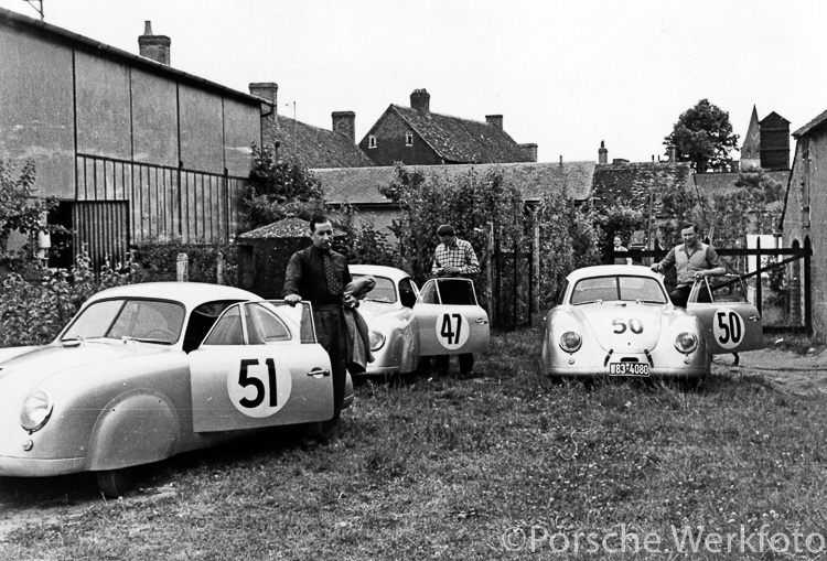 Three Porsche 356 SLs parked behind the workshop at Teloché