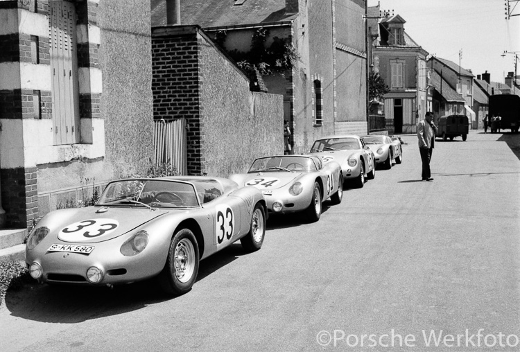 Lined up in the street outside the Teloché workshop, are (from front to rear) the #33 and #34 Porsche 718 RS 60, #35 Porsche 356 B 1600 GS Carrera GTL, and the #39 Porsche 718 RS 60