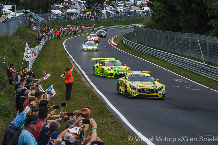 During the formation lap, the fans are allowed down to the track side to wave to the drivers before the race