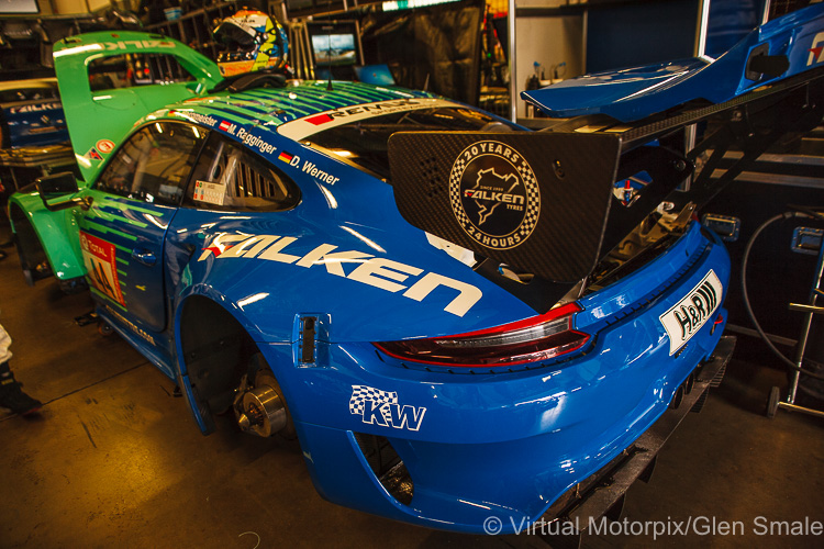 The #44 Falken Porsche in the pit garage before the start of the race