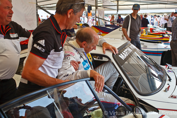 Hans-Joachim Stuck tries to squeeze into the seat of the 935/78 Moby Dick at the 2013 Goodwood Festival of Speed