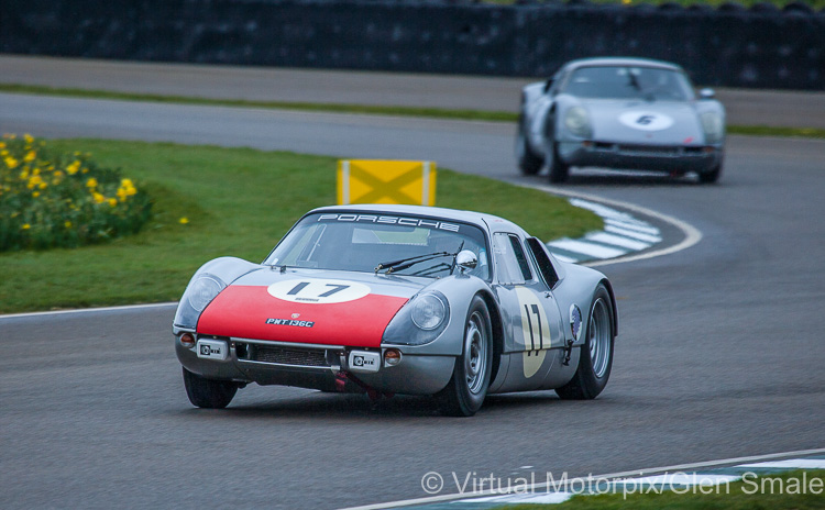 The #17 Porsche 904 Carrera GTS (1965) leads the #6 Porsche 904 Carrera GTS (1964) through Woodcote