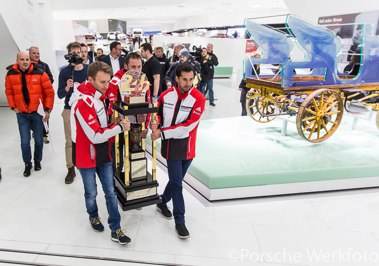 Timo Bernhard, Nick Tandy (behind trophy) and Neel Jani