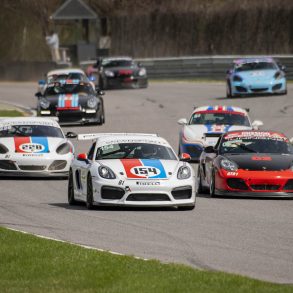 Various Porsche racecars on the track