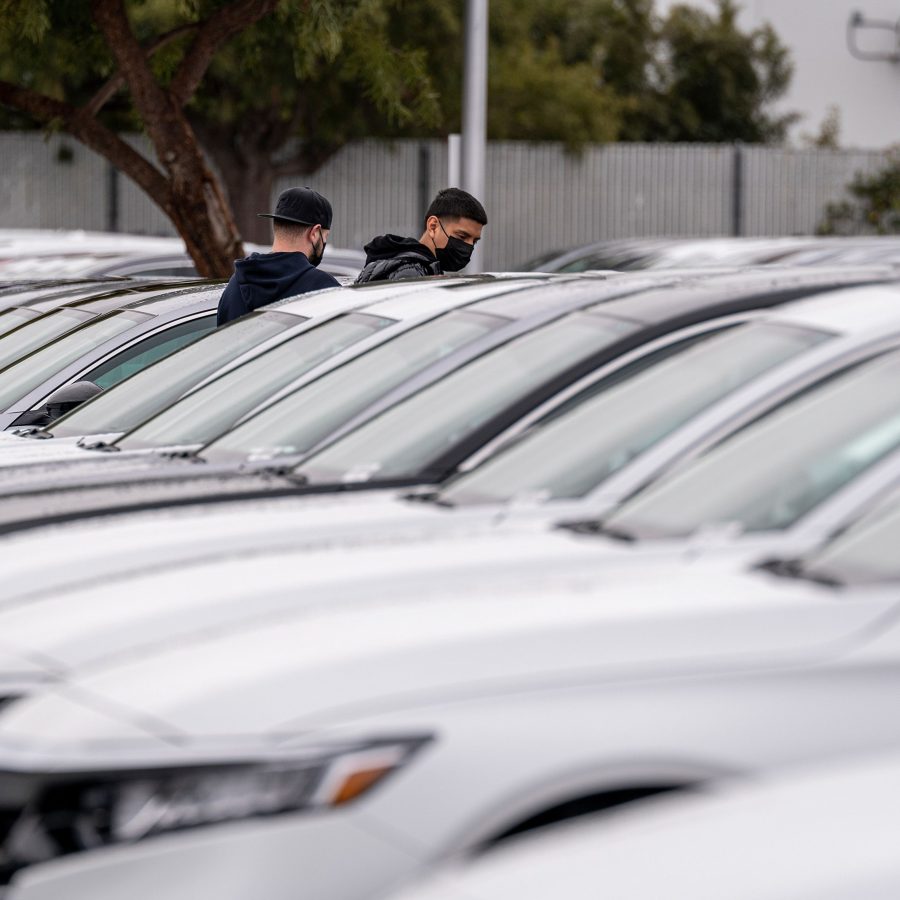 two buyers at a car lot