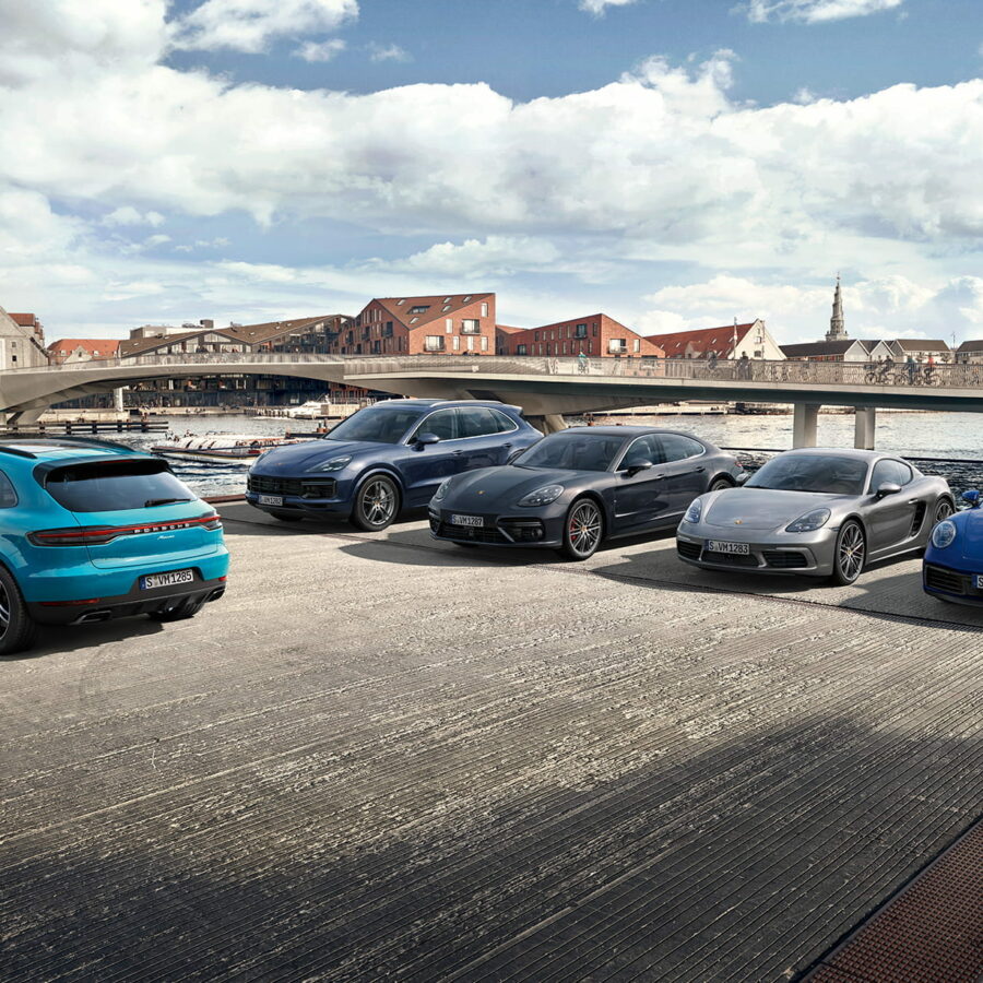 Studio shot of various Porsches outside