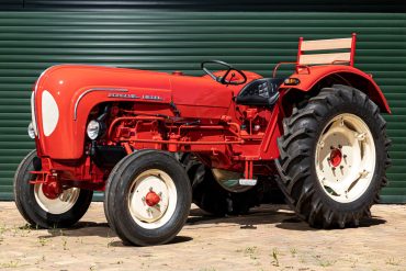 Three-quarter view of a red Porsche Tractor Model 219