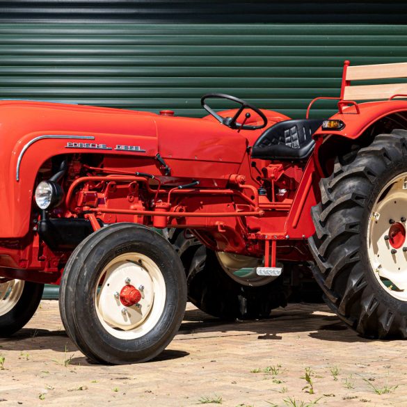 Three-quarter view of a red Porsche Tractor Model 219